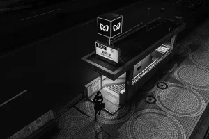 my favorite street photo is a woman leaving Shinjuku Subway exit